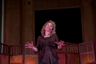 Donna Zerner settles the crowd with a joke. Photo Credit: Mike Bodine 